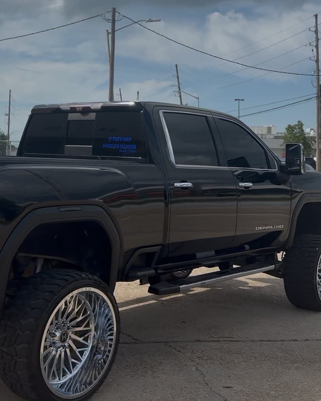 Lifted black GMC Sierra Denali HD on polished forged wheels, detailed by MJ's Mobile Detailing — after