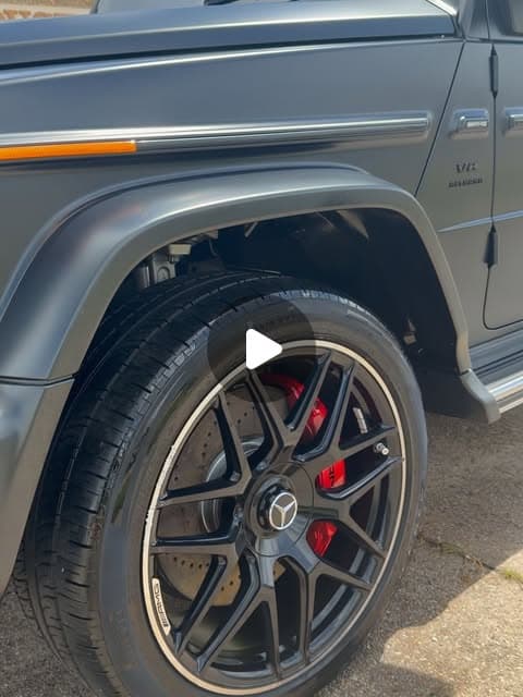 Mercedes G-Wagon wheel with a colored brake caliper visible behind the spokes, detailed by MJ's Mobile Detailing