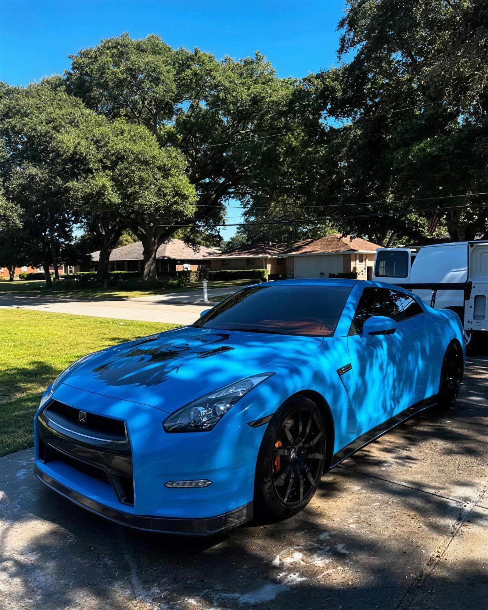 Electric blue Nissan GT-R with mirror-finish paint after a two-step paint correction by MJ's Mobile Detailing