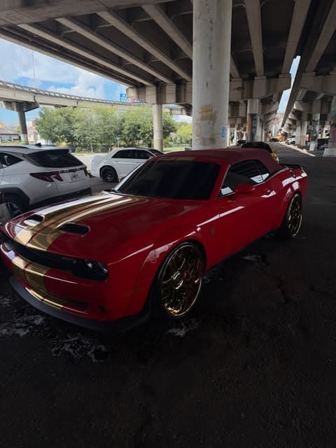 Red Dodge Challenger with gold wheels detailed on location by MJ's Mobile Detailing