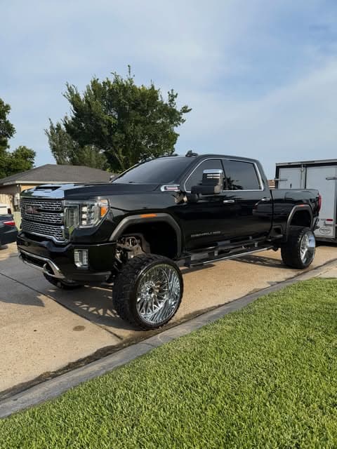 Lifted black GMC Sierra dually detailed on location by MJ's Mobile Detailing